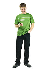 Image showing Smiling young man holding cell phone