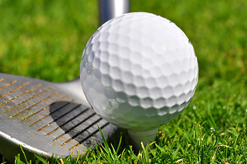 Image showing Golf ball and driver