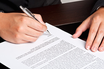 Image showing Signing a Document