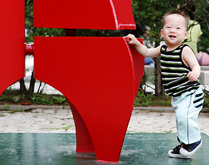 Image showing Cute Korean boy playing at the park
