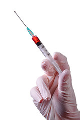 Image showing Hand holding a syringe