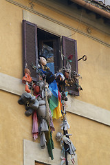 Image showing Soft-toys hanging out of a window