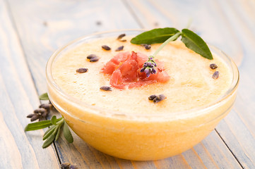 Image showing fresh melon soup with parma ham and lavender flower