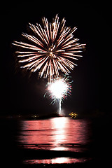 Image showing Fireworks Over Water with Reflections