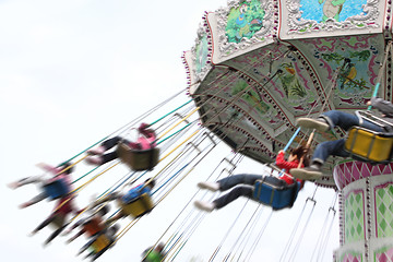 Image showing child plaaying flying swing in park