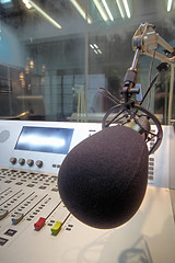 Image showing mic in front of the control panel in broadcasting studio 