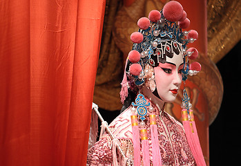 Image showing chinese opera dummy and red cloth as text space ,it is a toy,not