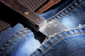 Image showing knife in jeans pocket 