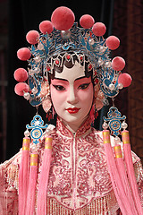 Image showing chinese opera dummy and red cloth as text space ,it is a toy,not