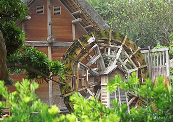 Image showing water wheel on old grist mill in forest