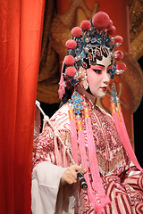 Image showing chinese opera dummy and red cloth as text space ,it is a toy,not