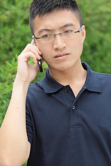 Image showing chinese man talking phone and worry