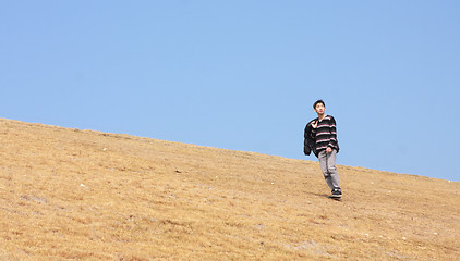 Image showing man walking on the mountain