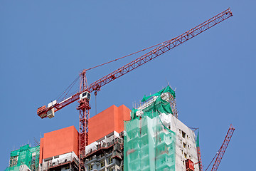 Image showing Construction crane at the construction site, on a cloudless sky 