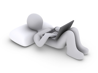 Image showing Person lying down with laptop