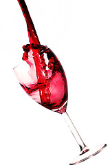 Image showing splash of wine in glass  on white