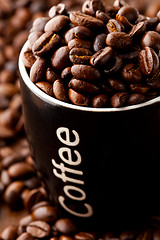 Image showing Coffee beans and a coffee mug