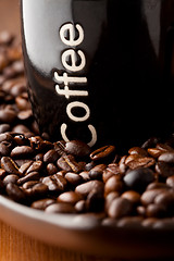 Image showing Coffee mug with coffee beans