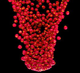 Image showing Red apples flow isolated on black 