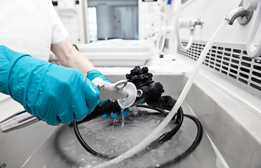 Image showing hand with glove  is cleaning hospita equipment