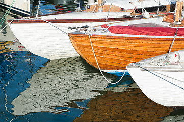 Image showing Yachts and their reflections in water