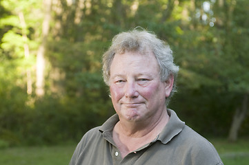 Image showing middle age senior man in suburban backyard