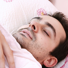 Image showing Young man sleeping .