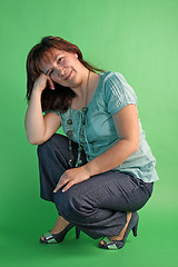 Image showing fashion woman on green background. studio shot.