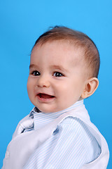 Image showing Portrait of a happy baby boy Isolated on blue background