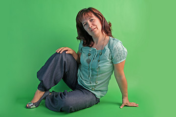 Image showing fashion woman on green background. studio shot.