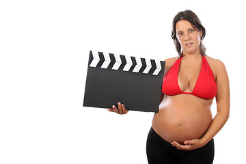 Image showing pregnant woman with beautiful belly holding movie clacket