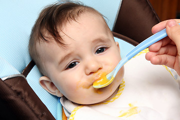 Image showing beautiful child eating soup, food child photo