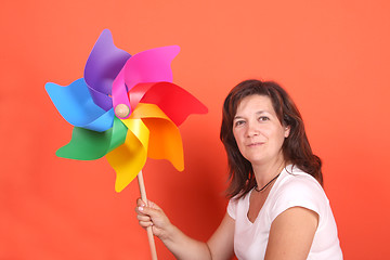 Image showing beautiful girl with wind mill, studio session shoot