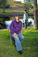 Image showing  beautiful woman in an autumn park 