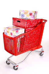 Image showing Shopping cart with lots of presents isolated on white background