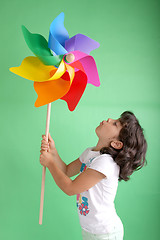 Image showing beautiful girl with wind mill, studio session shoot