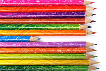 Image showing Assortment of coloured pencils with shadow on white background