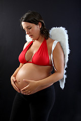 Image showing Beautiful pregnant girl with innocent angel wings