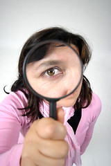 Image showing Young businesswoman holding Magnifying Glass, business photo