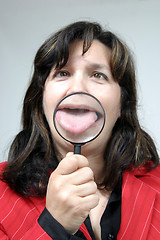 Image showing Young businesswoman holding Magnifying Glass, business photo