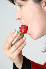 Image showing beautiful woman with beautiful red strawberries, healthy food