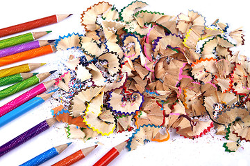 Image showing Assortment of coloured pencils with shadow on white background