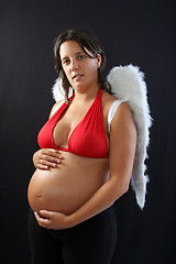 Image showing Beautiful pregnant girl with innocent angel wings