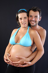 Image showing beautiful and happy & young pregnant couple 