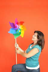 Image showing beautiful girl with wind mill, studio session shoot