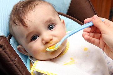 Image showing beautiful child eating soup, food child photo