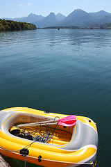 Image showing Yellow inflatable boat on mountain lake