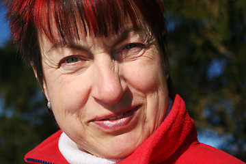 Image showing Outdoor portrait of smiling senior woman