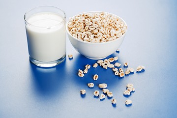 Image showing Popped wheat seeds and glass of milk