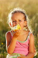 Image showing Girl eating an apple